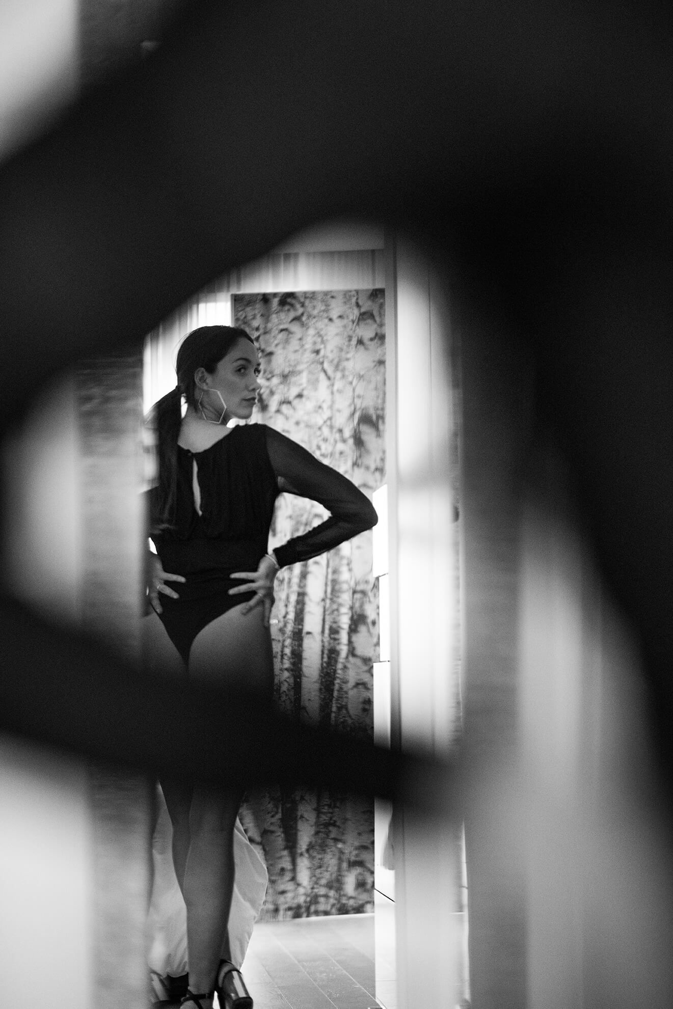 Artistic black and white silhouette photography series showing abstract poses against a light background.