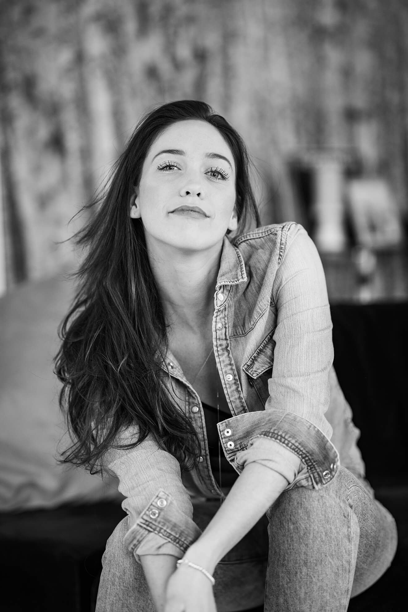 Moody black and white portraits with denim styling and dramatic poses.