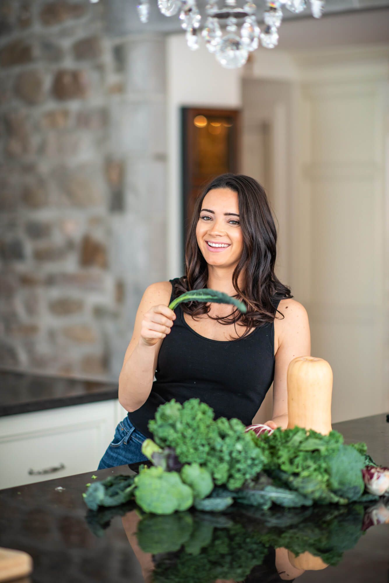Preparing healthy meal with fresh green vegetables in modern kitchen.