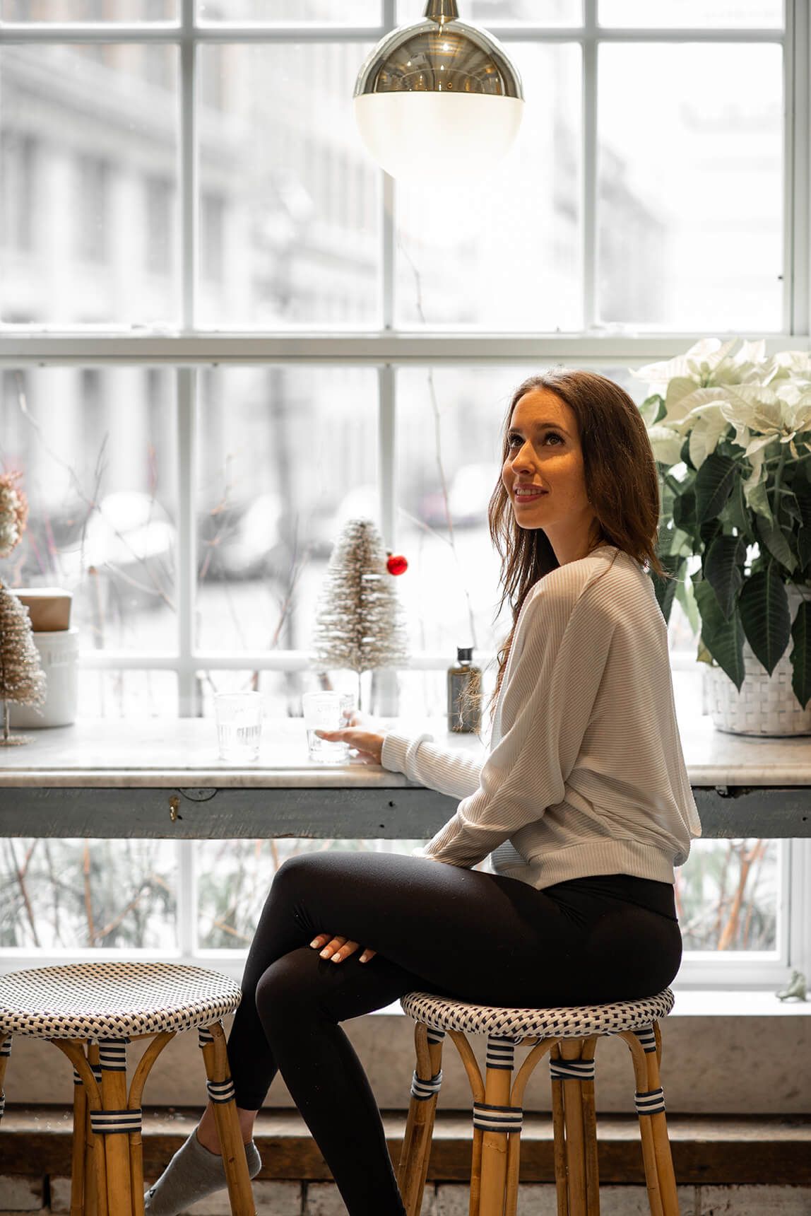 Casual indoor lifestyle photography session near bright windows.