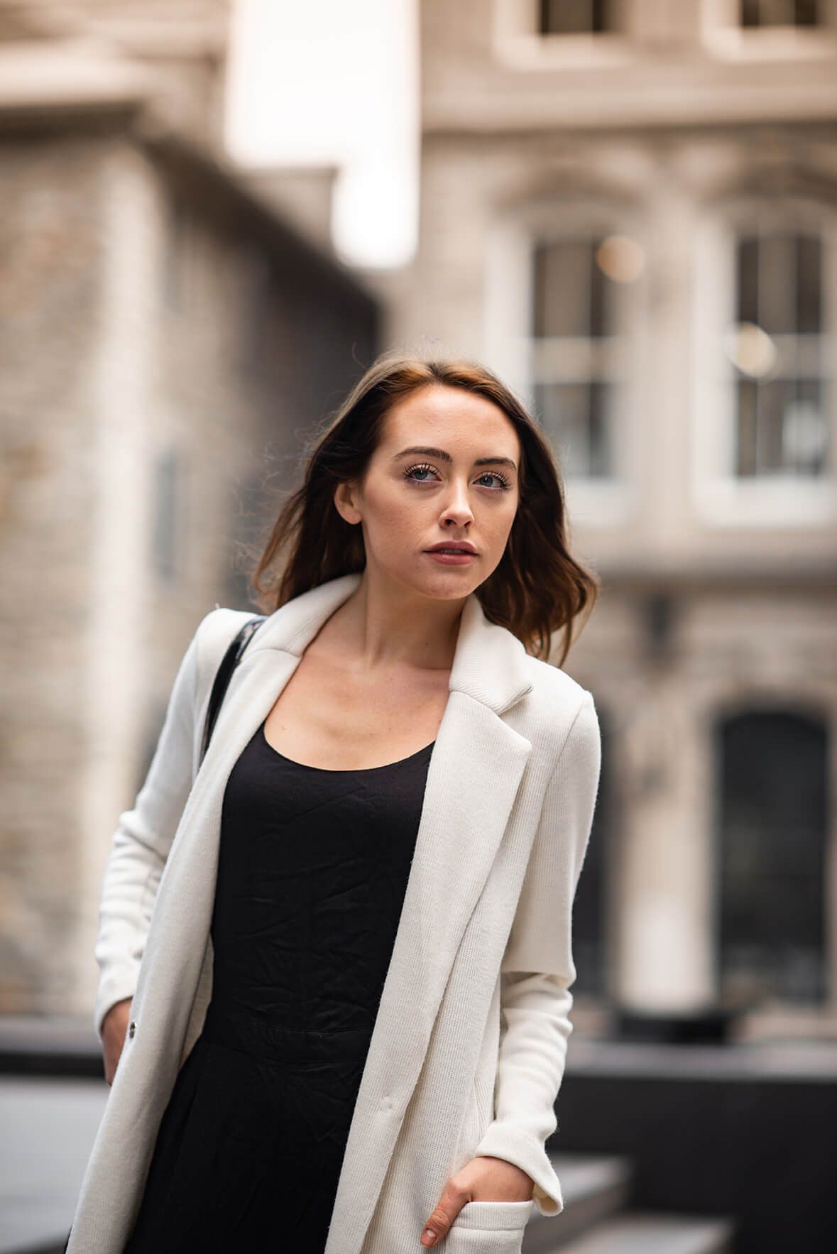 Urban fashion portrait series featuring classic black and white professional attire.