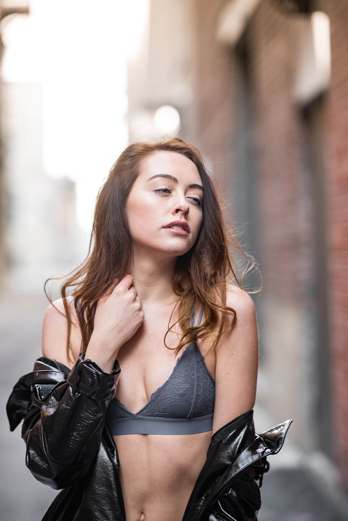 Artistic portrait with natural lighting showcasing casual street style.