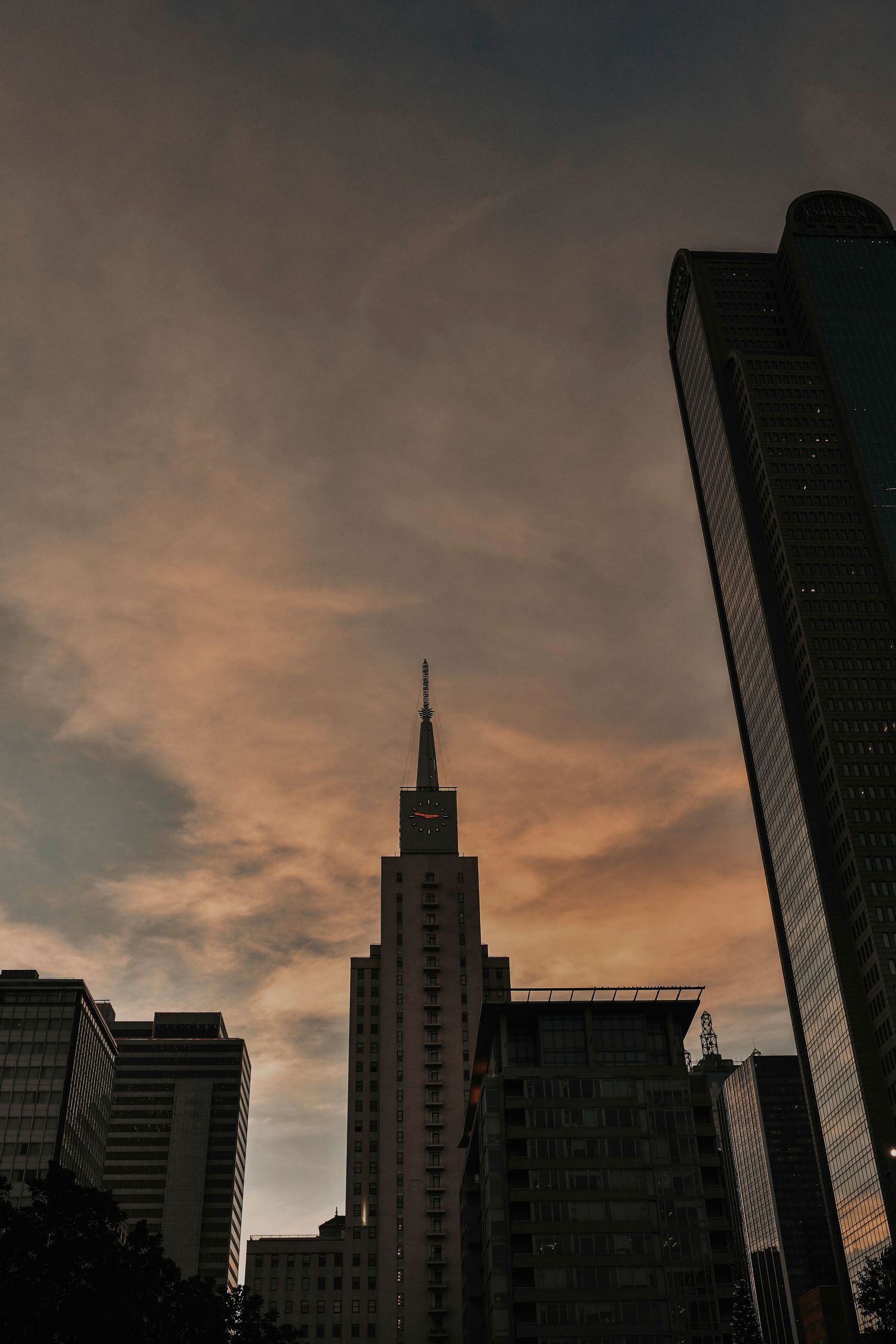 Downtown Dallas engagement photography capturing couple in a vintage urban setting