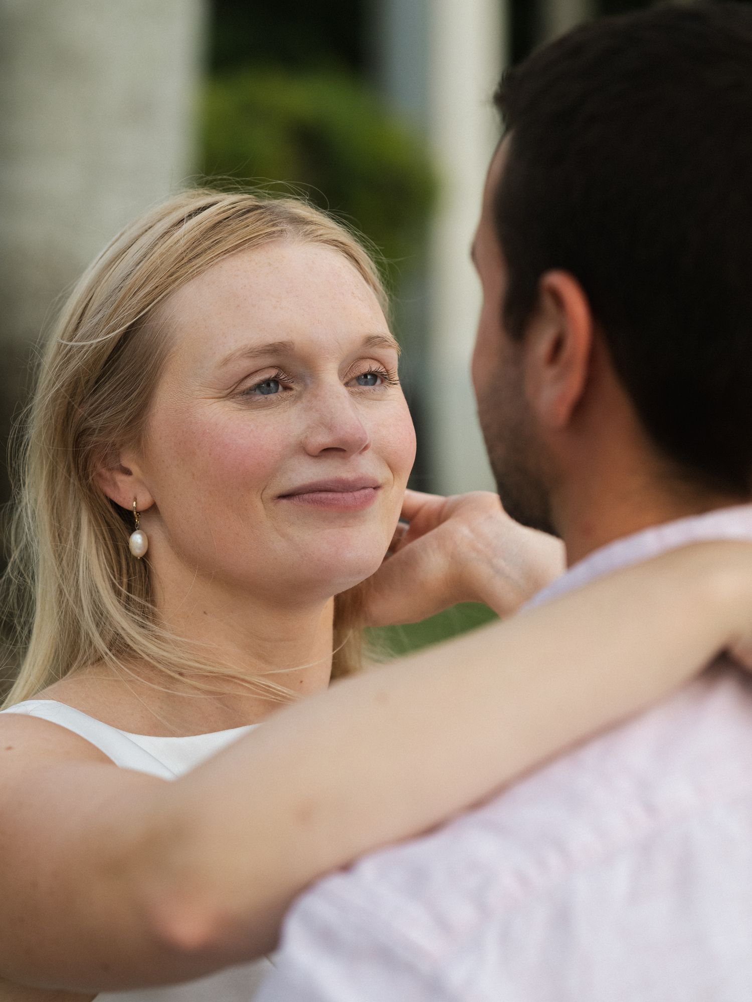 Close-up sequence of a couple sharing intimate dance moments outdoors.