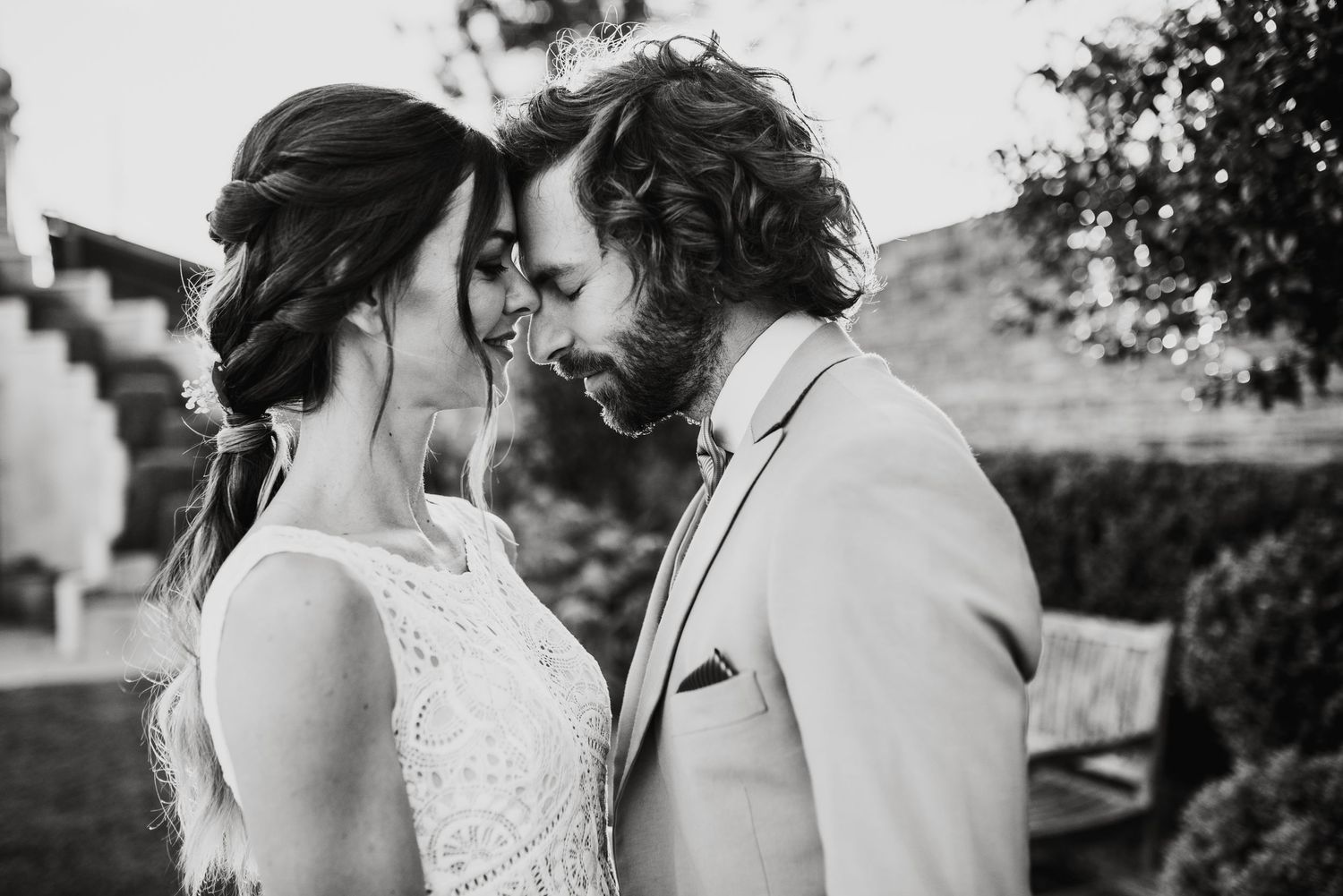 Intimate outdoor wedding moments captured in black and white photography.
