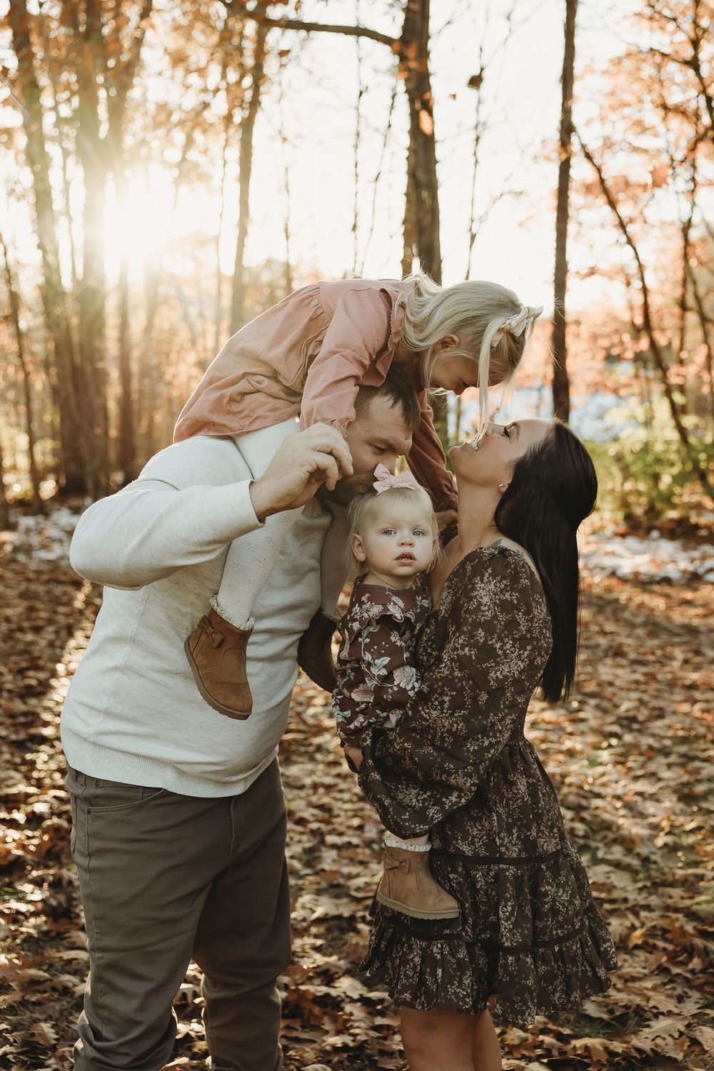 A sequence of playful autumn forest photos showing two people sharing a tender moment among fallen leaves.