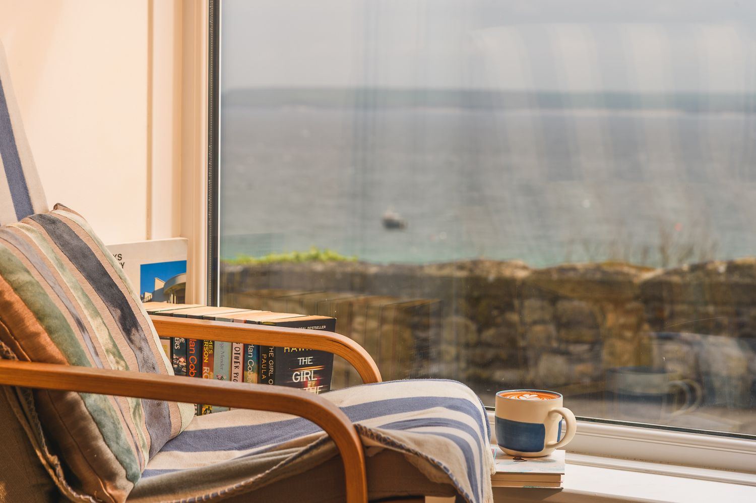 relaxing window seat with a coffee and a good book