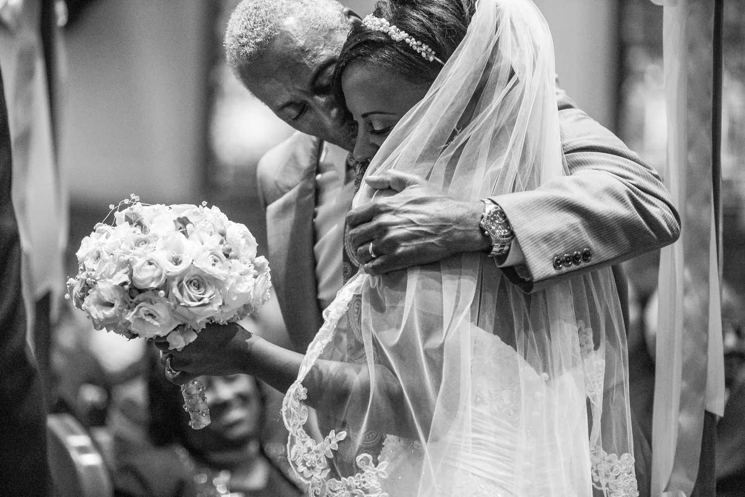 Black and white wedding photo collage showing romantic moments between a bride and groom during their ceremony.