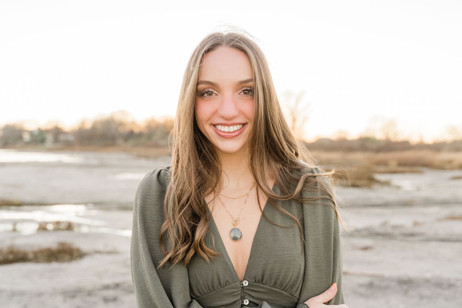 Toledo senior photographer with Class of 2027 senior at sunset