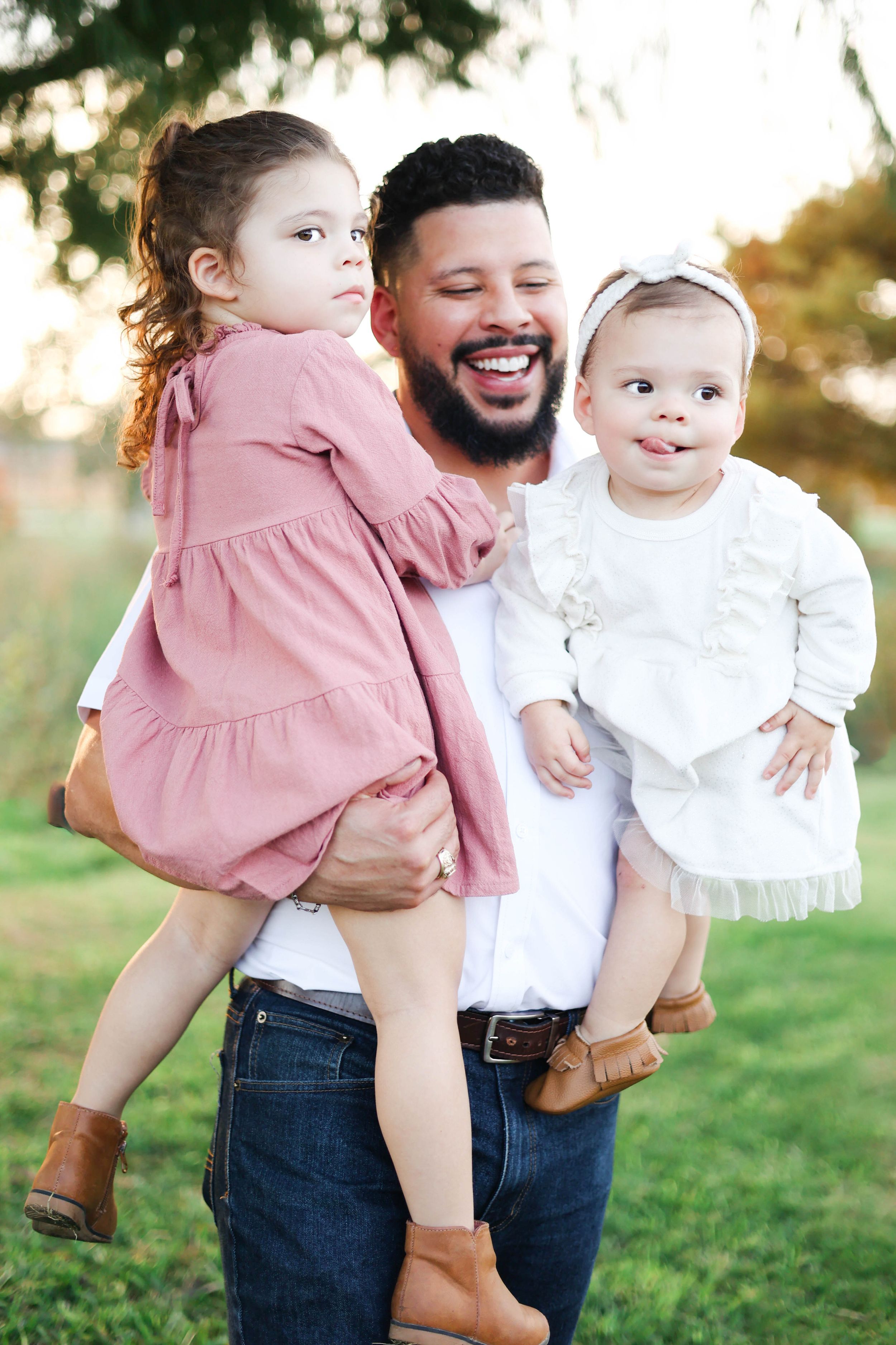 Father with children in the park playing, laughing, smiling.