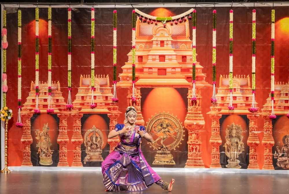 Ornate red and gold traditional Thai temple interior with illuminated decorative elements and ceremonial drums.