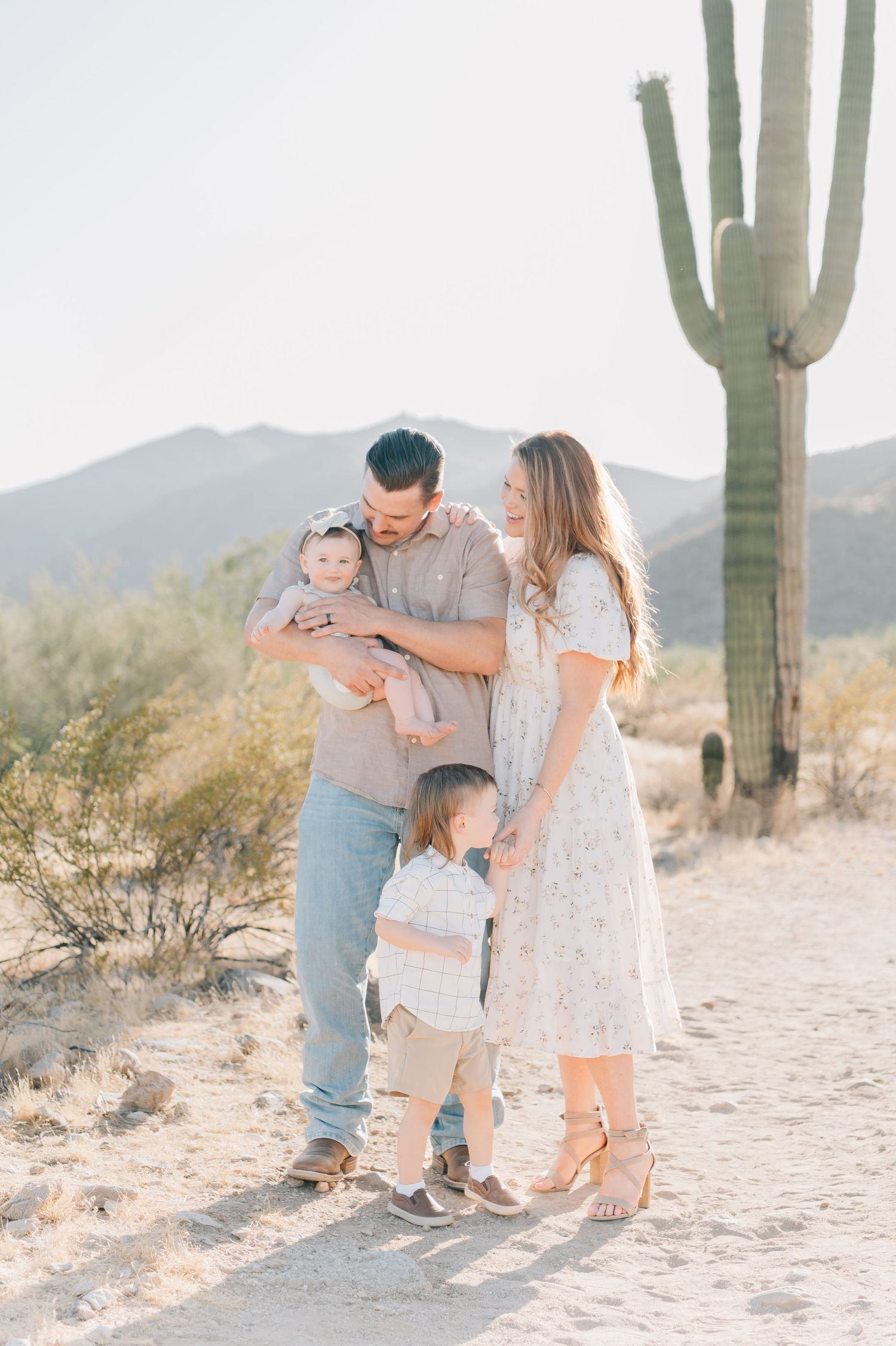 Family of 4 having photos taken in Arizona Desert.