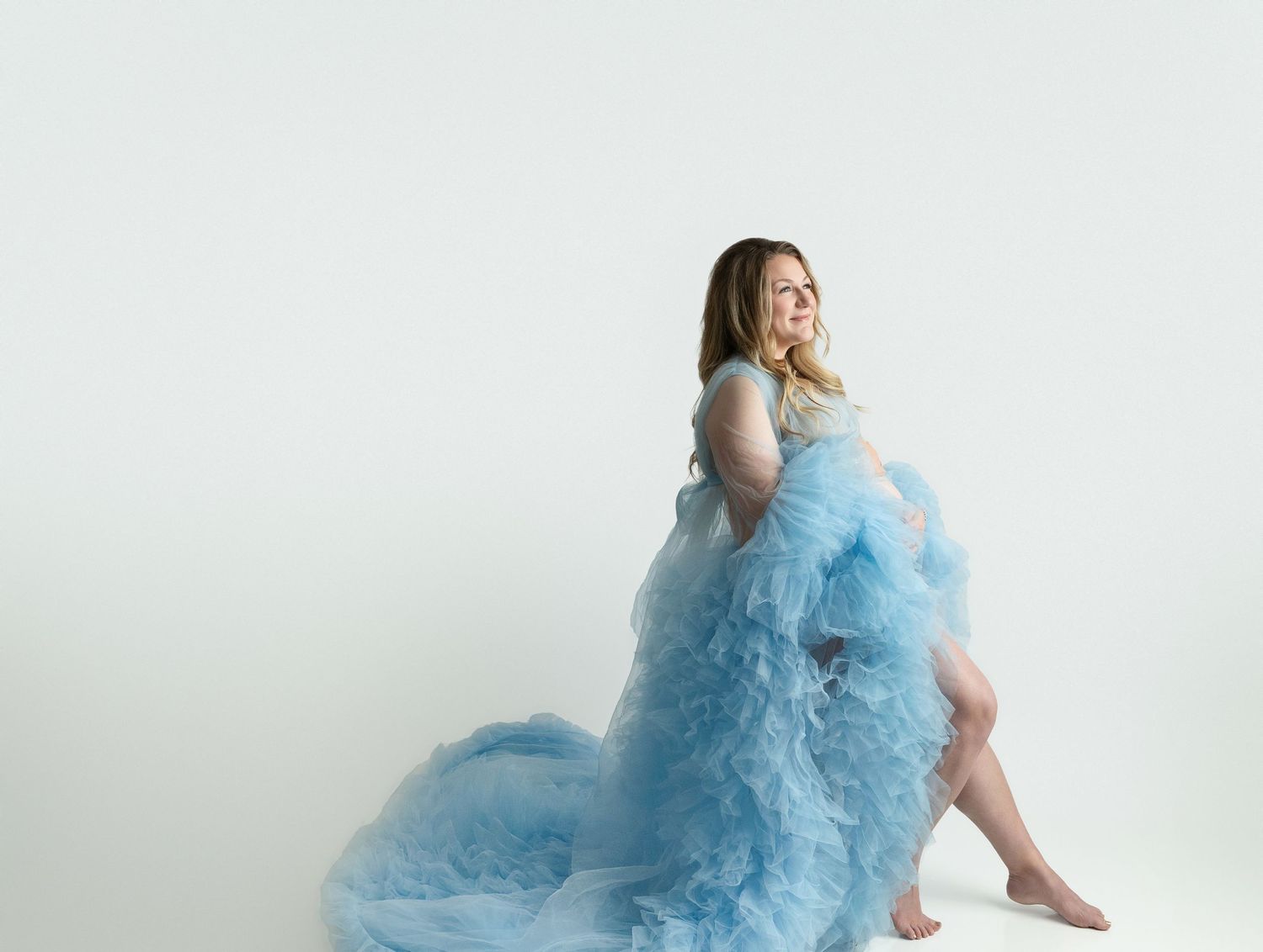 Mom wearing a beautiful blue robe with ruffles for her maternity session. Greenville SC newborn photographer, Easley SC newborn photographer
