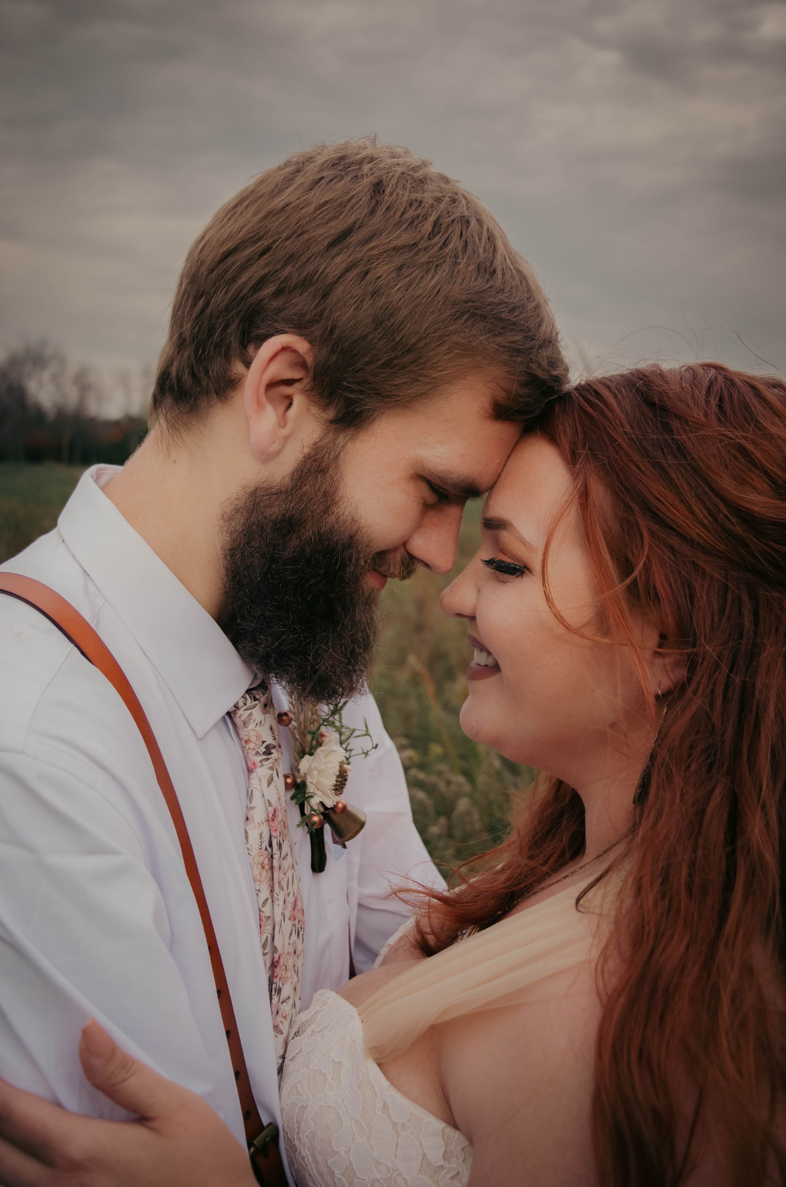 Intimate romantic moment between couple at sunset.