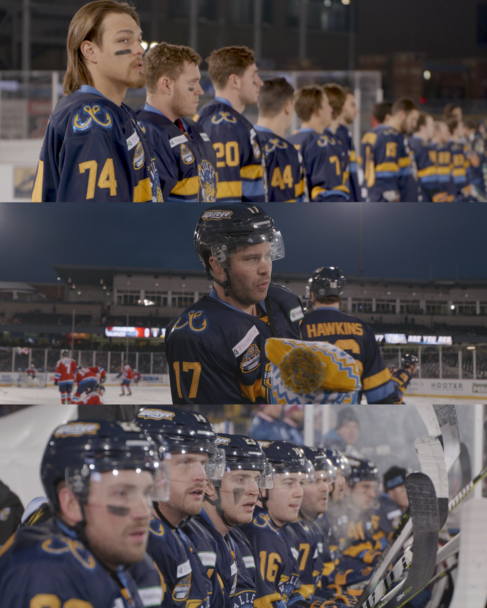 Hockey players in navy and yellow jerseys line up on the ice during a game sequence.
