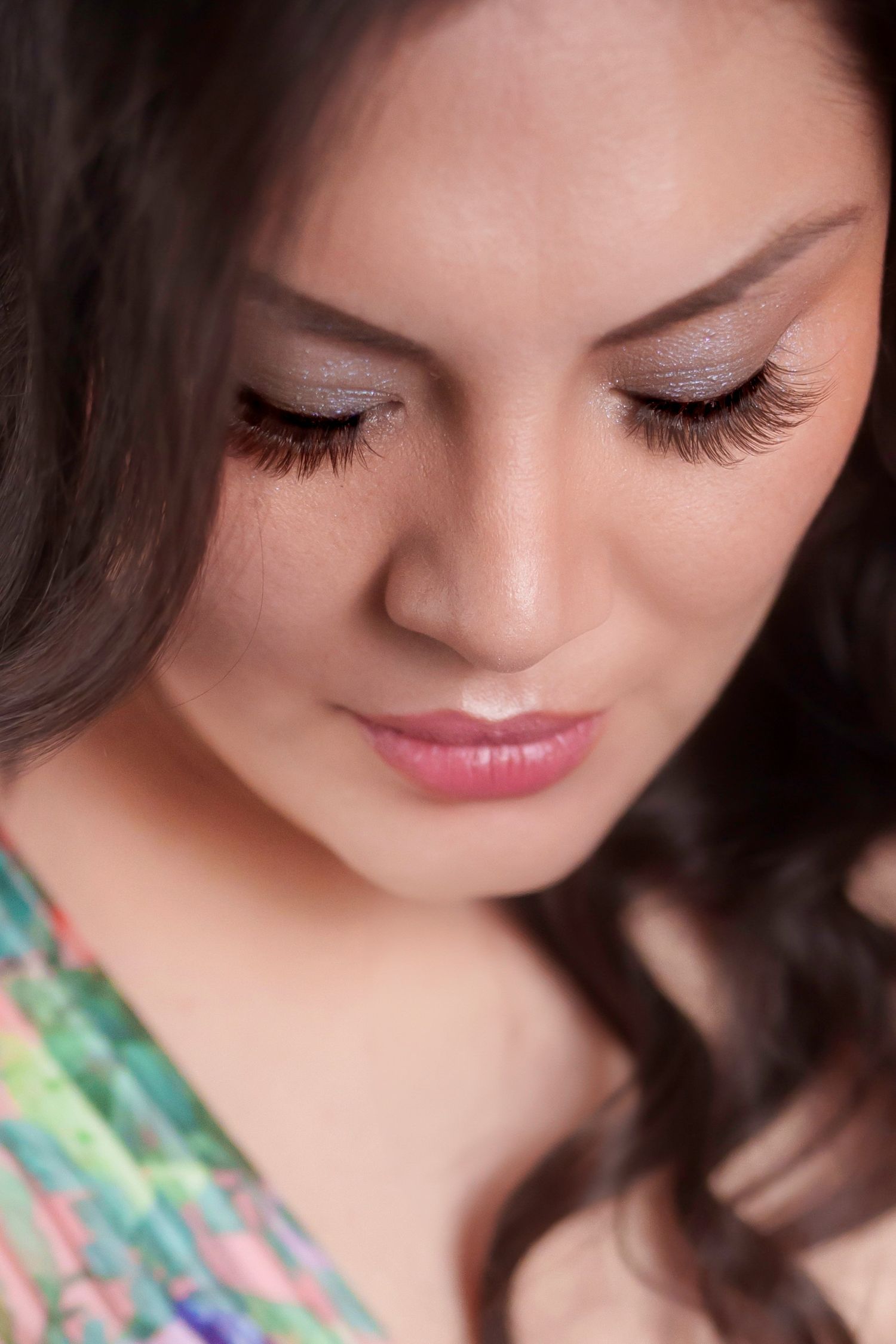 Close-up beauty shot showing shimmer eyeshadow and long lashes.