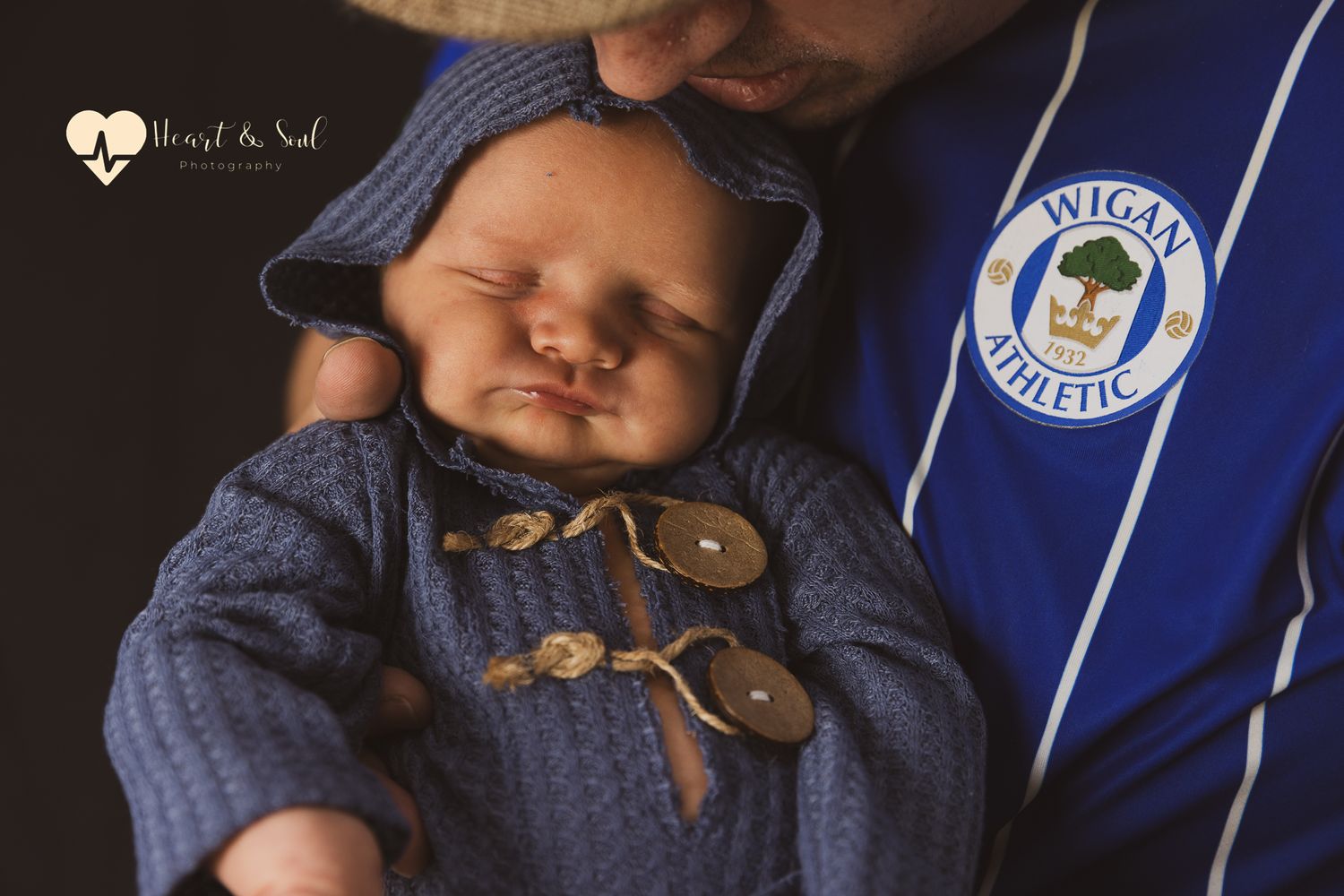 Baby sleeping in mans arms