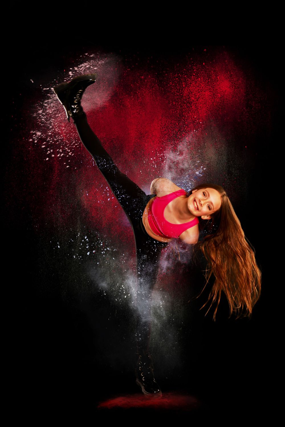 Dynamic dance sequence in red and black showing graceful movement with powder effects creating dramatic atmosphere.