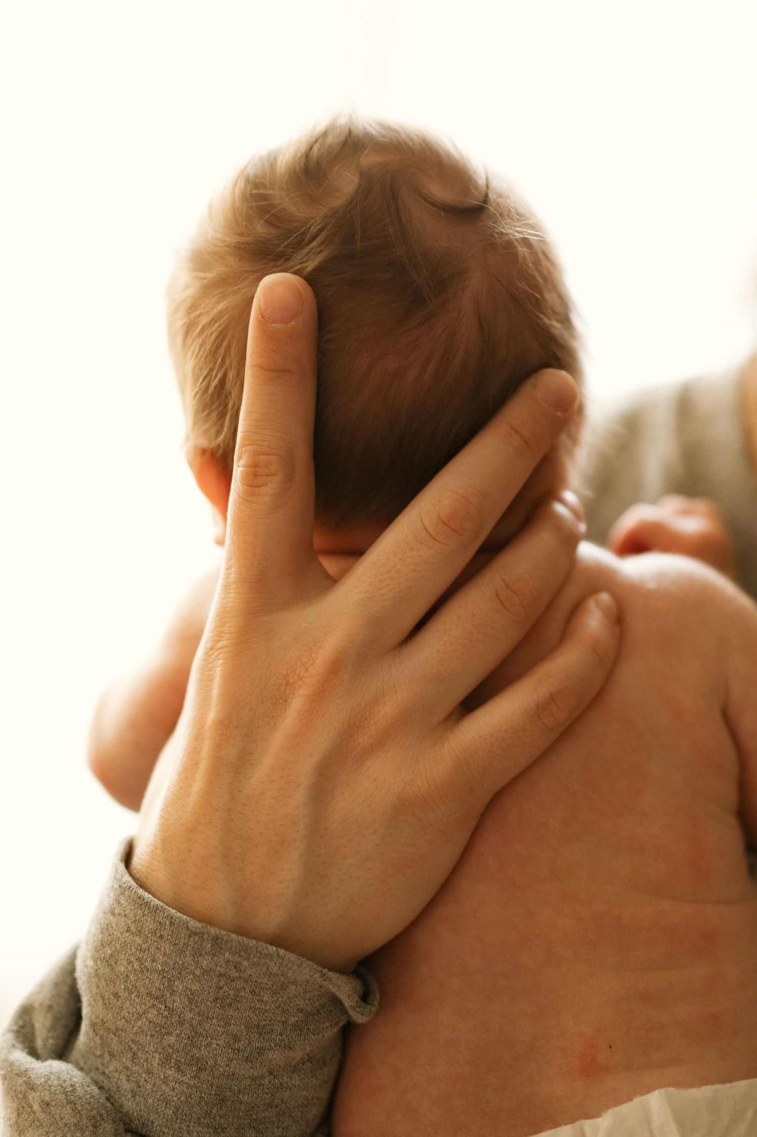 A series of close-up photos showing hands covering face in distress or despair against neutral background.