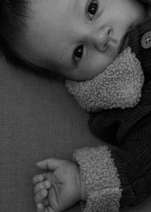 Black and white close-up capturing tender details and soft textures.