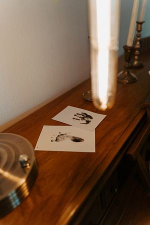 Black and white photograph displayed on wooden surface in natural light.