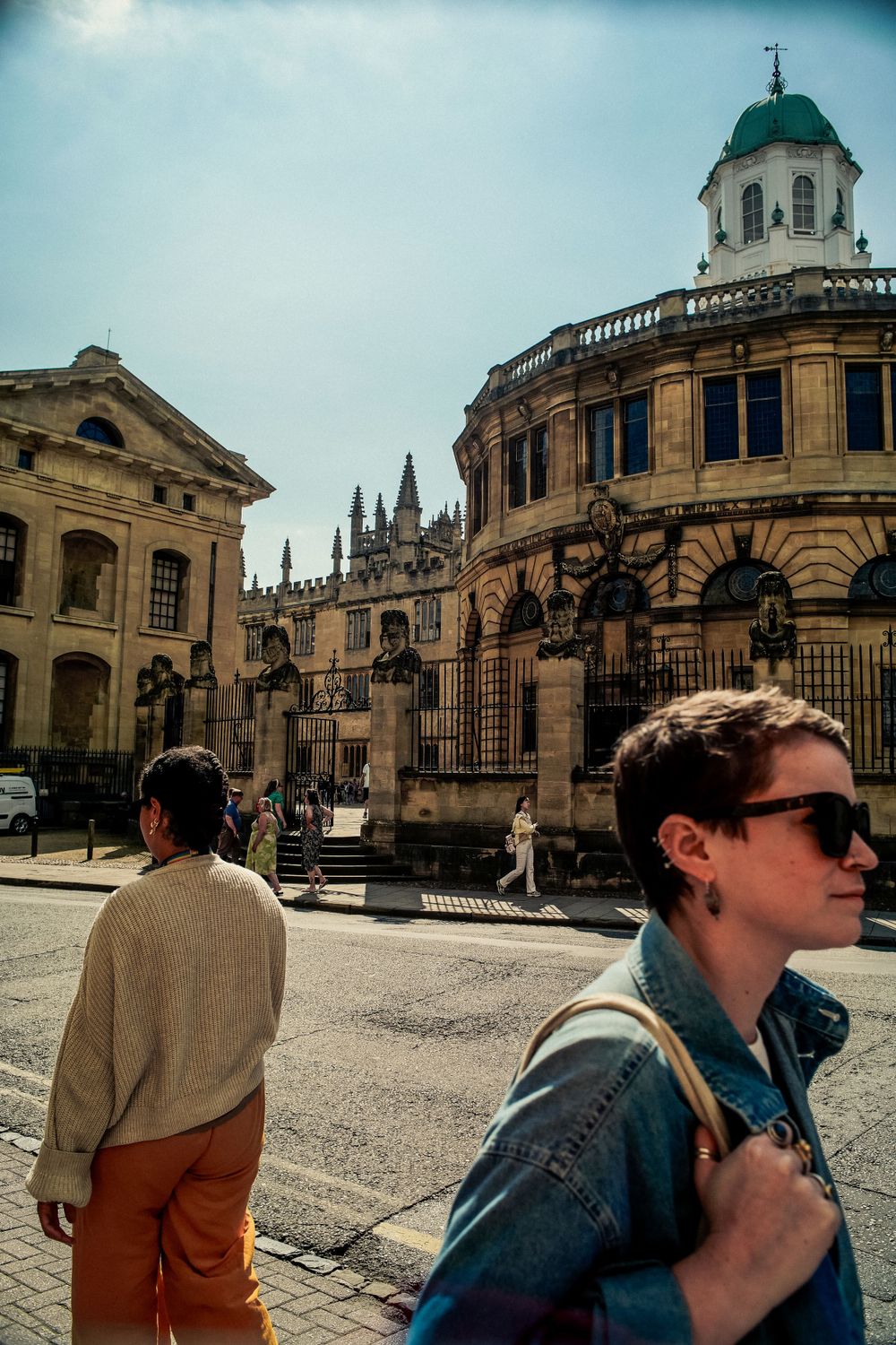 Historic architecture of Oxford University buildings with classical domed structure and spires.