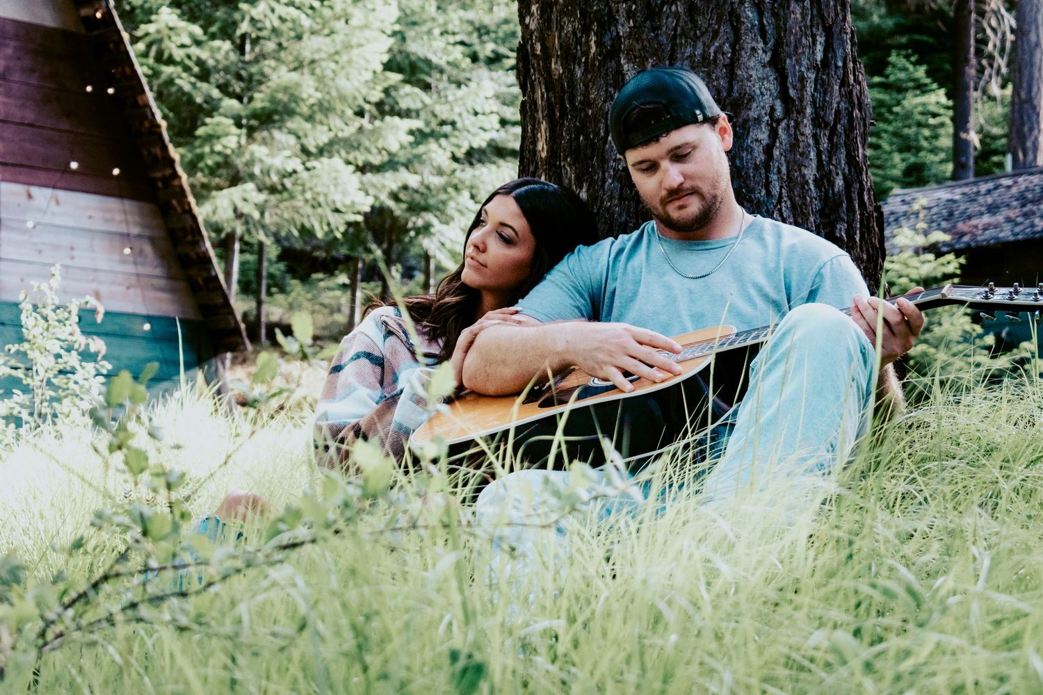 Cozy forest couples session with boho vibes and acoustic guitar—ideal for storytelling portraits in the PNW woods around Mount Rainier.