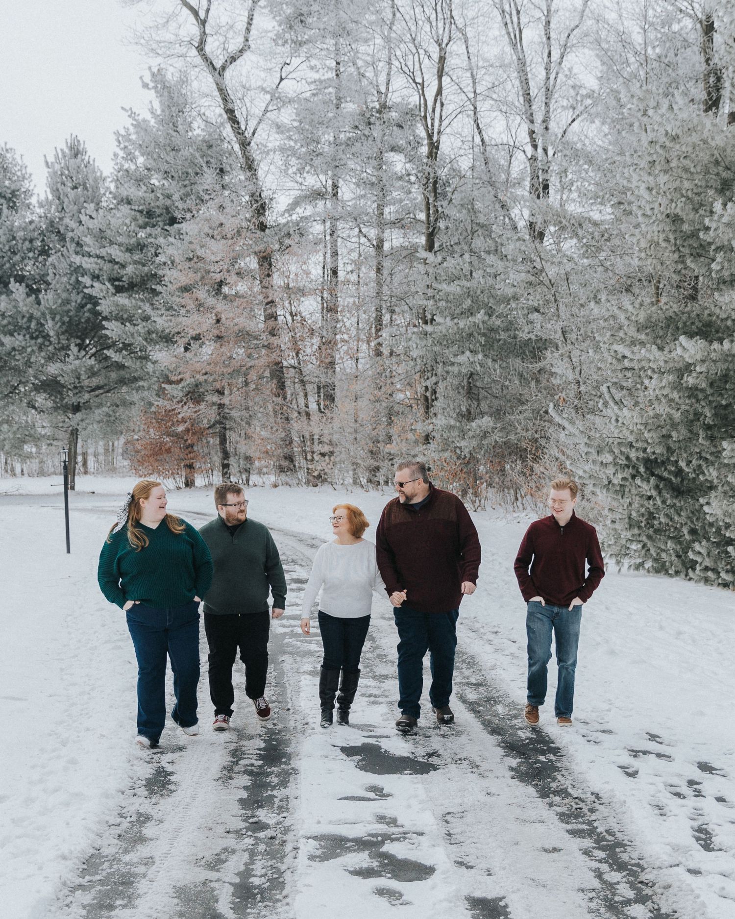 family walking through snow