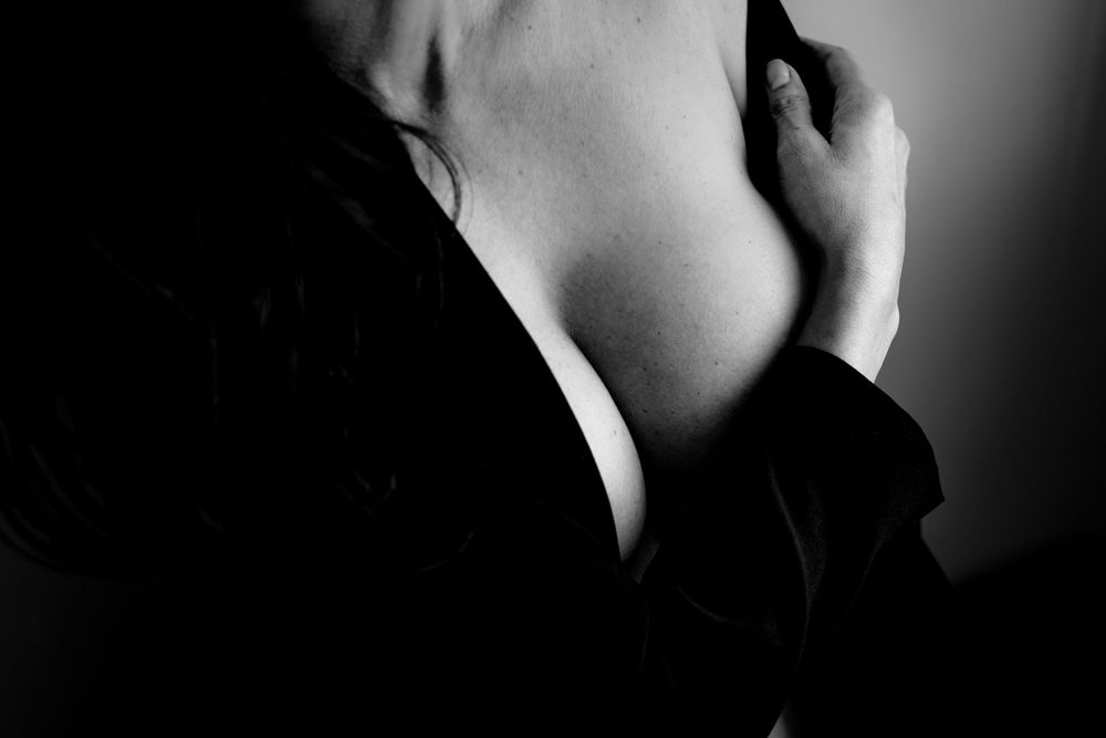 A sequence of black and white closeup photos showing the sensual curves of a person's neck and shoulders.