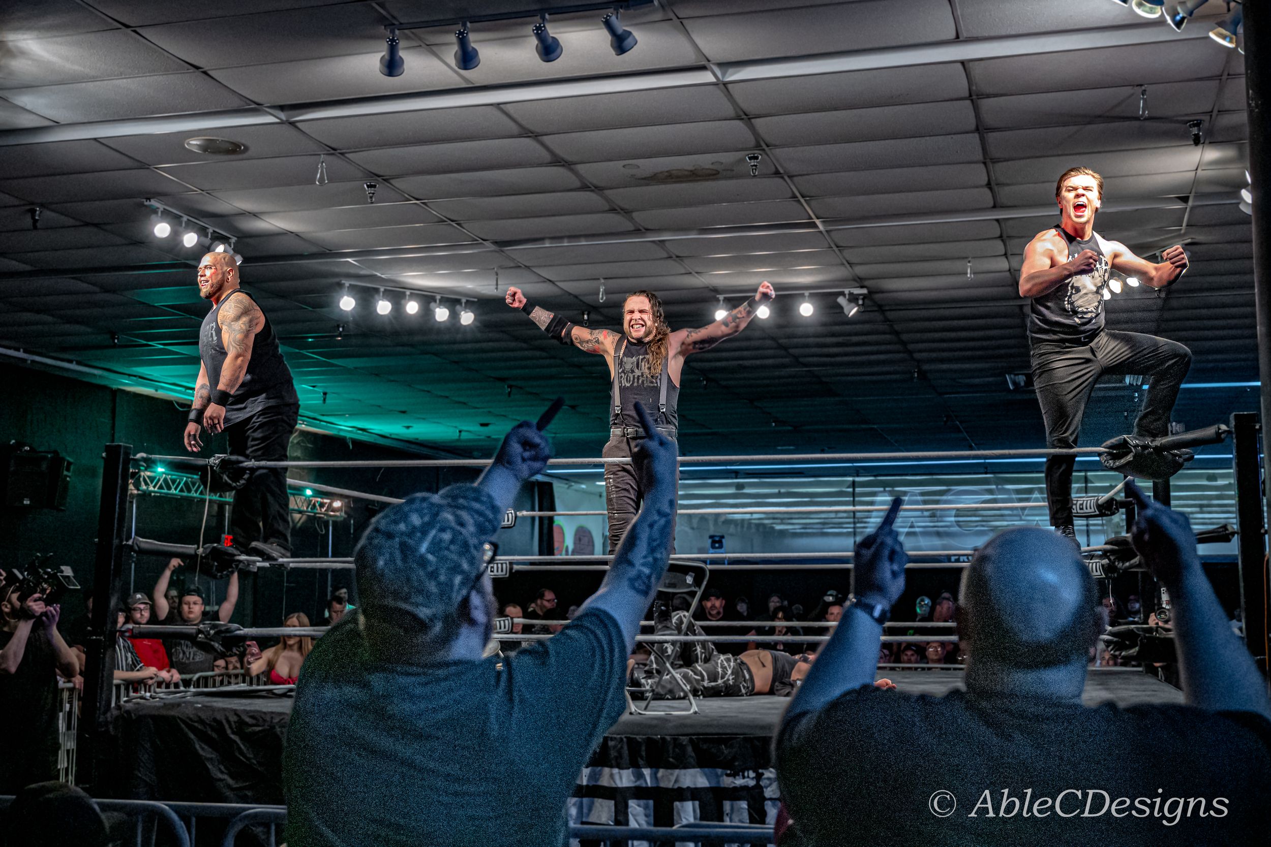 The Cogar Family stands victorious after beating Joey Janella and Mr. Danger at GCW.