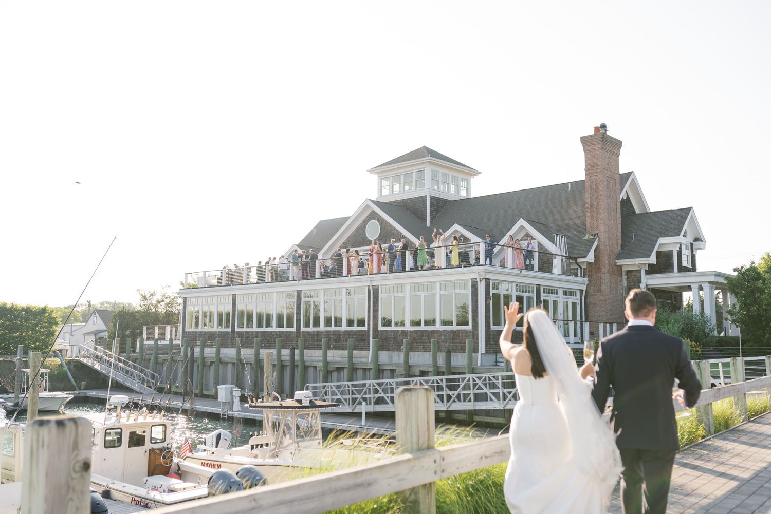 Waterfront wedding venue with classic New England architecture and marina views.