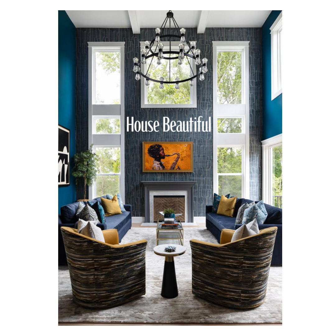 Modern dark living room features two curved brown chairs, blue walls, and a stone fireplace with contemporary decor.