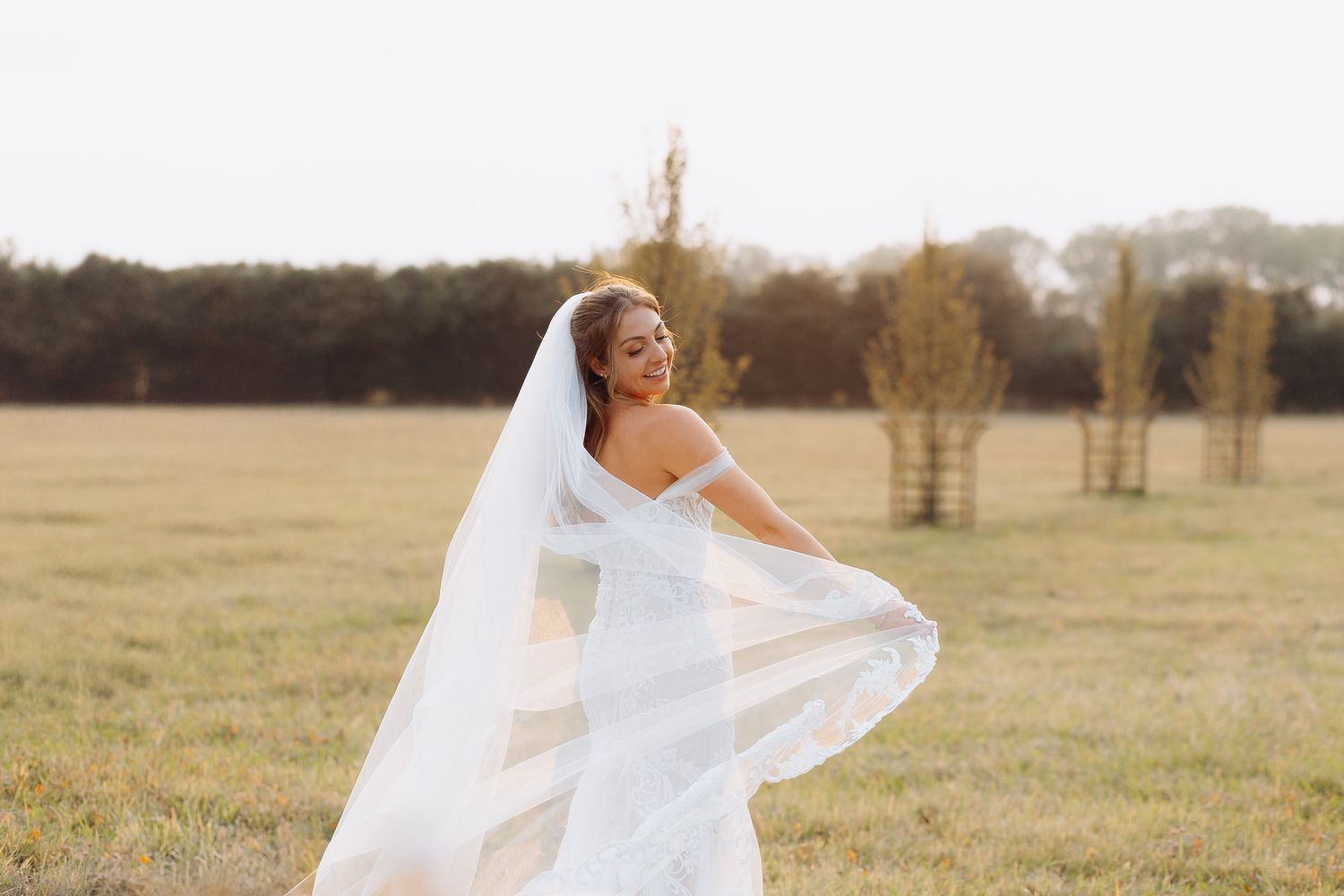 Cotswolds wedding photographer capturing natural moments at Kingscote Barn wedding venue.