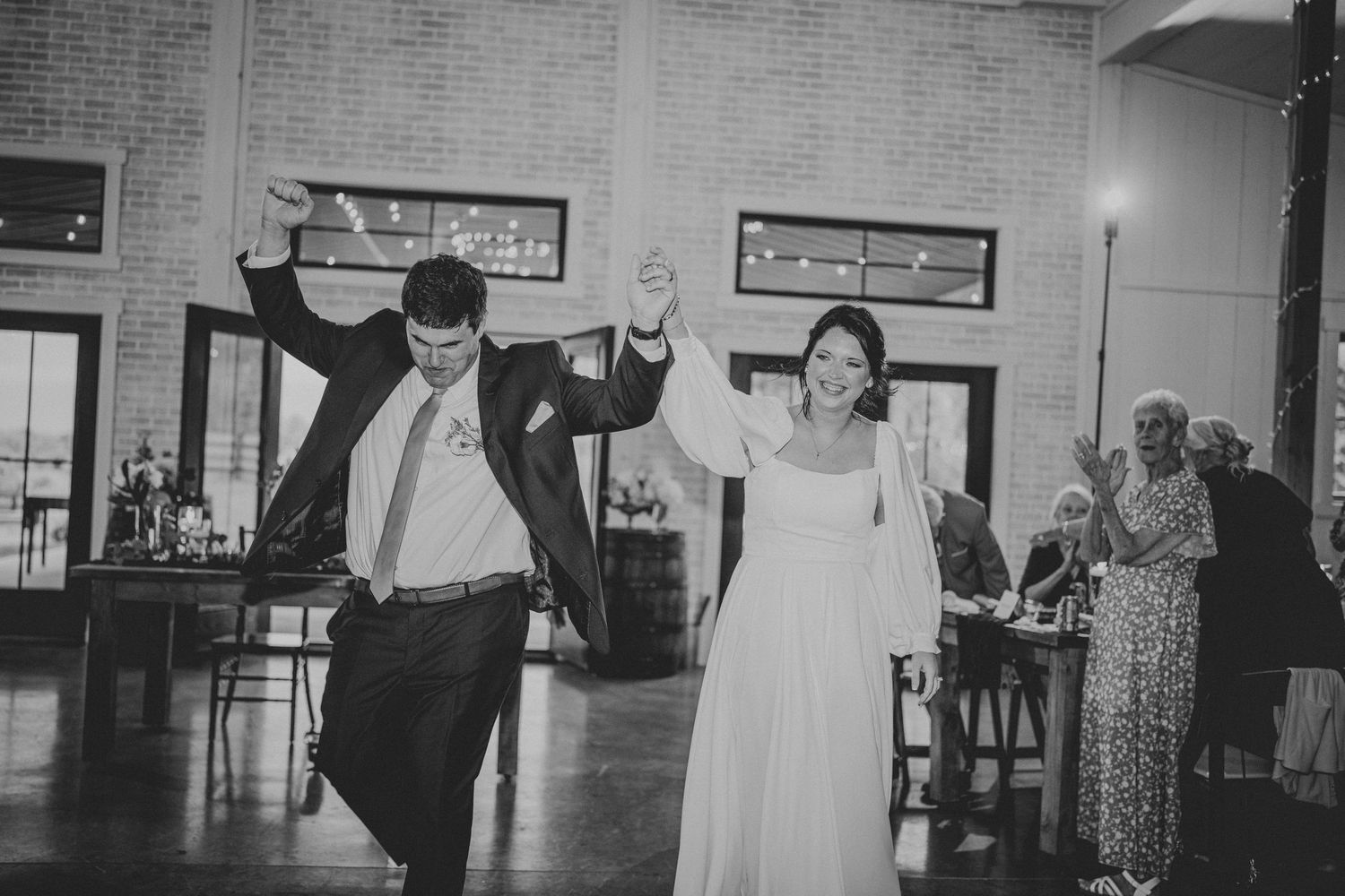 A black and white photo collage shows dancers in various poses moving across a dance floor at what appears to be a social event.