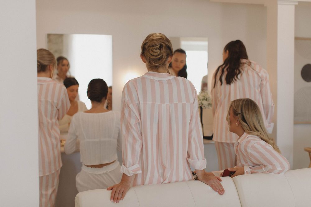 Getting ready scene with people in matching striped robes.