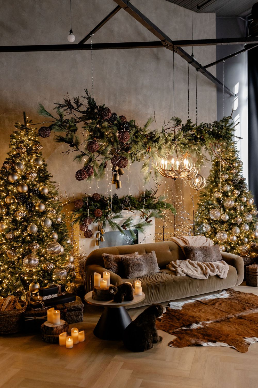 A cozy living room decorated with illuminated Christmas trees, string lights, and rustic decor creates a warm holiday atmosphere.
