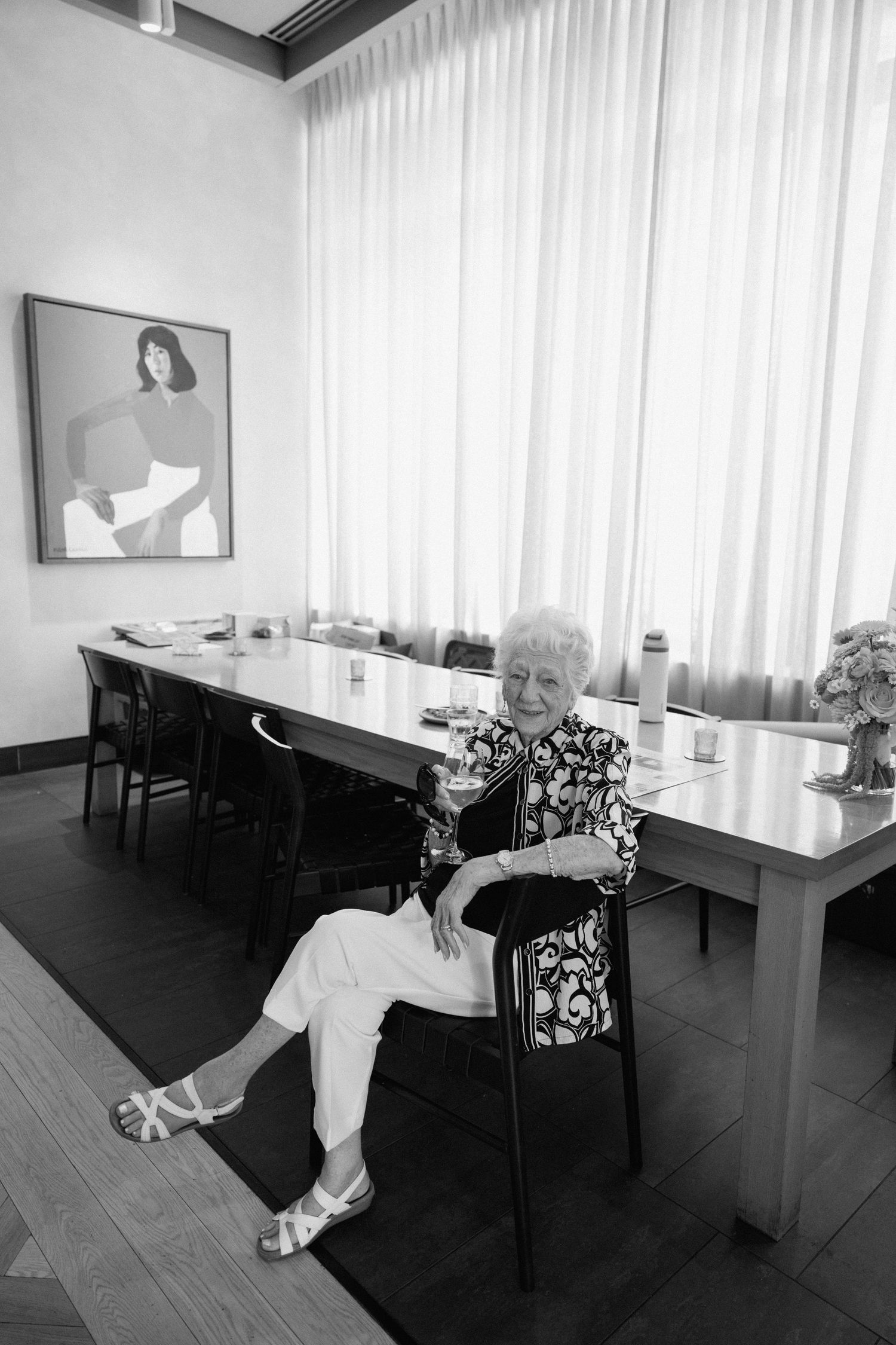 Black and white sequence showing someone falling backwards dramatically in a dining room setting.