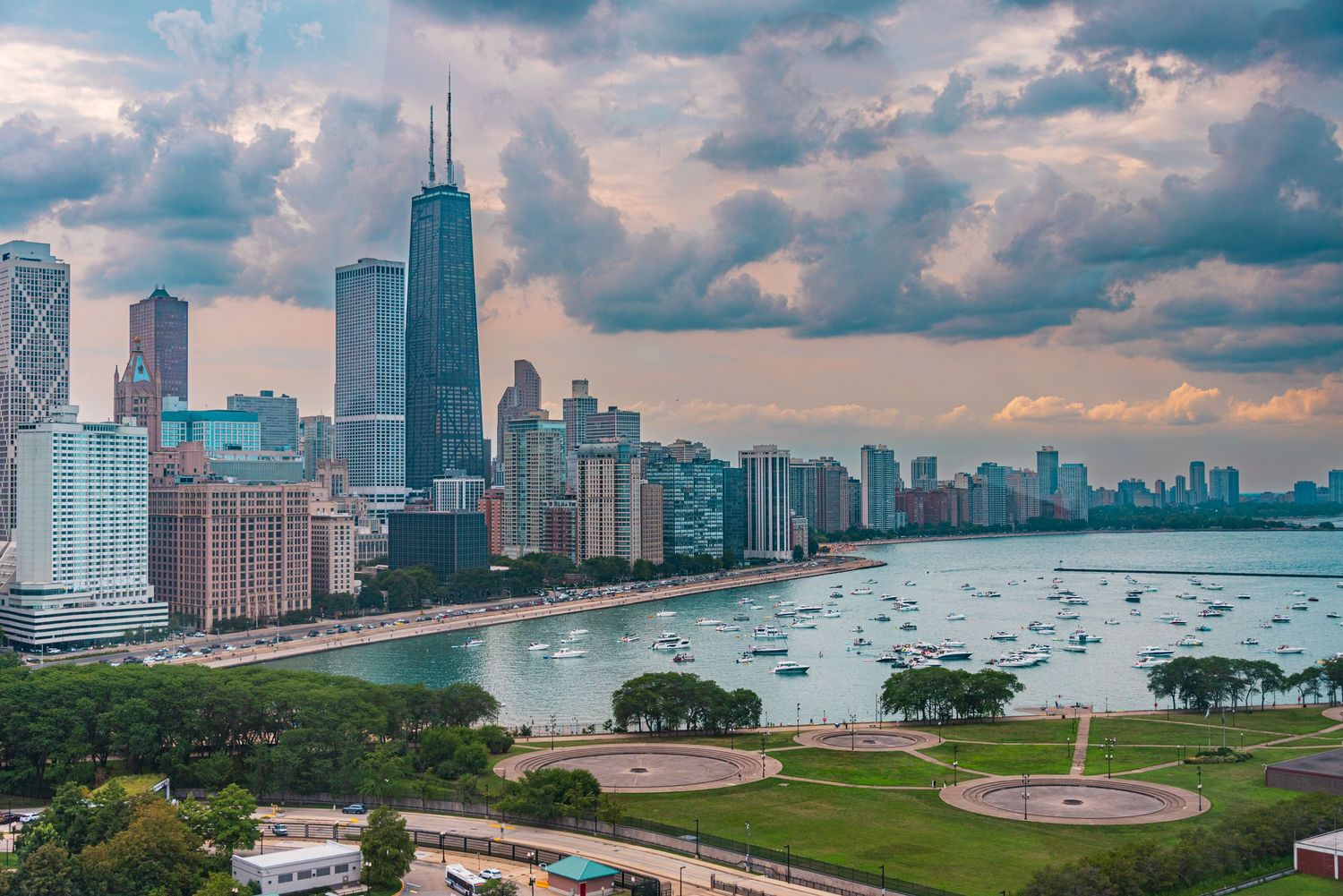 Chicago skyline and Lake Michigan waterfront viewed from Grant Park on a cloudy evening.