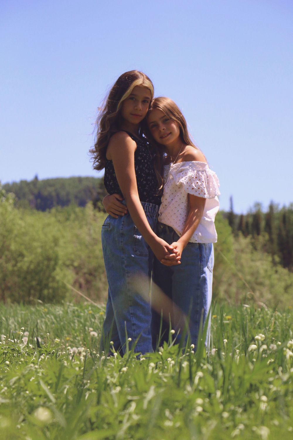 One of my favorite photos ever...we have a good blooper that includes a Bumble bee and Dandelion too but that's for another day!  Sisters.