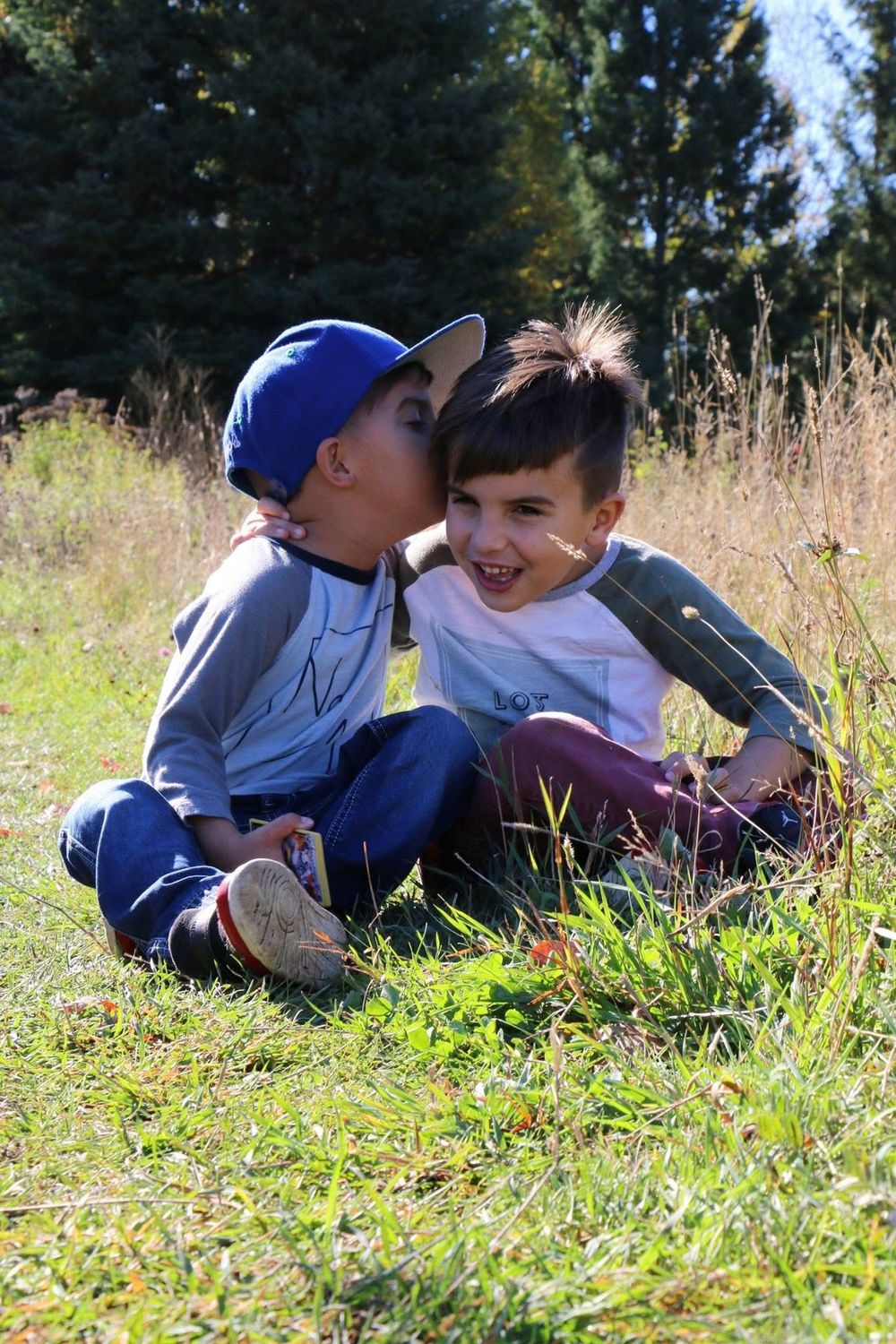 My boys...they don't always cooperate but you have to go with the flow. Telling goofy secrets, playing with cards...candid photos...CHECK!