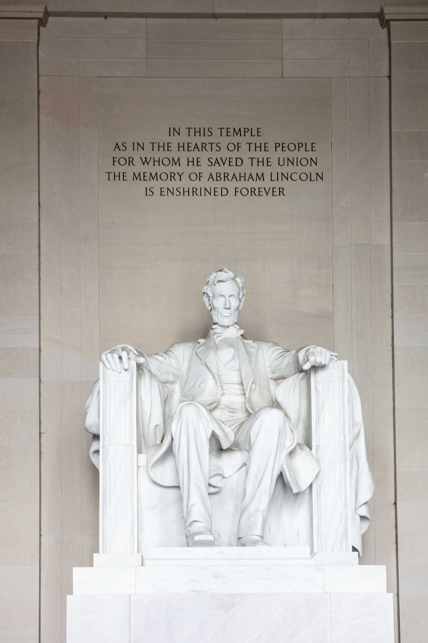 Lincoln Memorial statue with inscription text above in Washington DC.