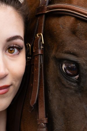 A woman and her horse, cropped in tight to highlight the details in their eyes at an equine portrait session near Cle Elum, Washington.