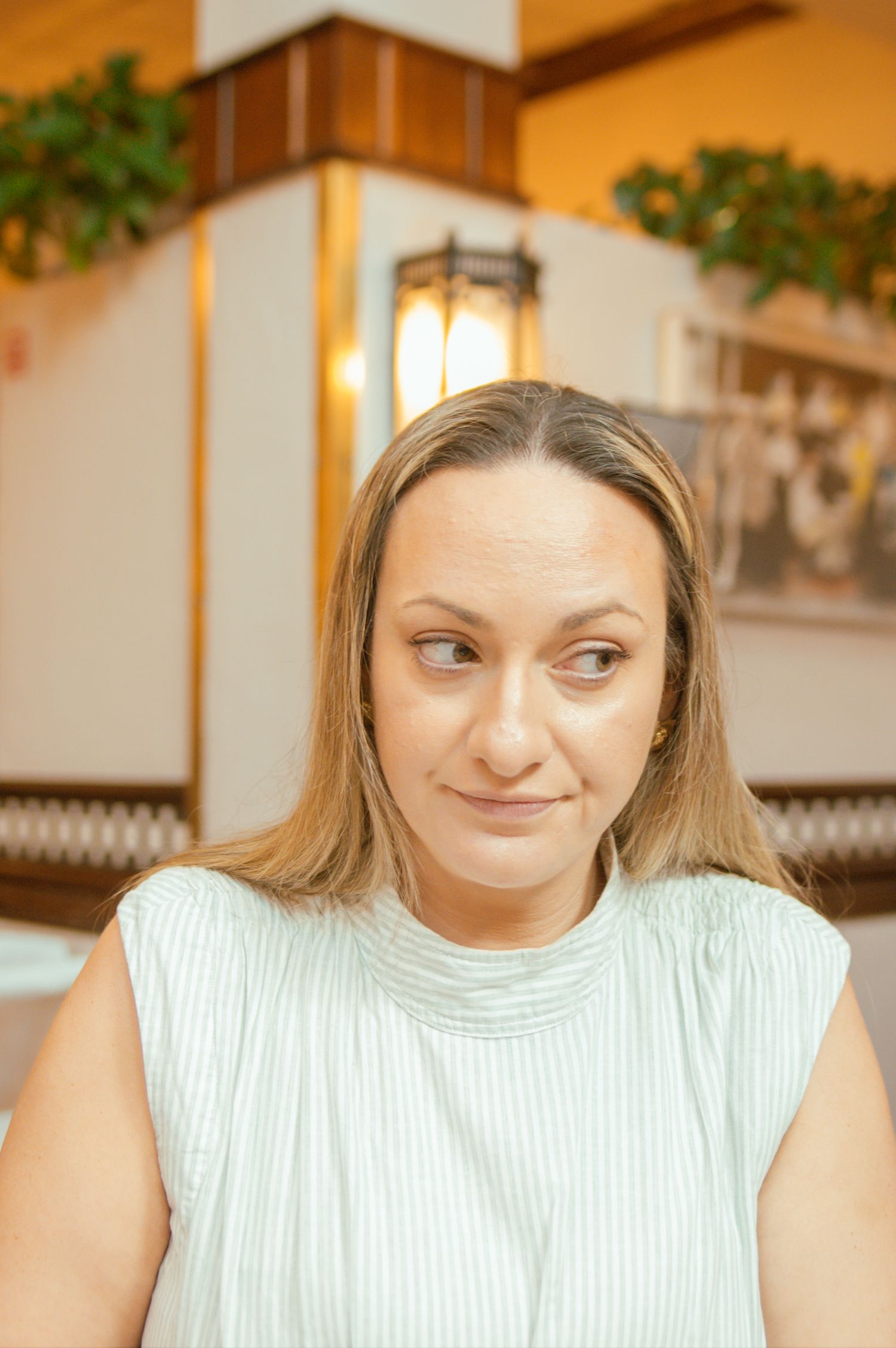 Sequential photos show facial expressions transitioning from neutral to smiling in an indoor setting with warm lighting.
