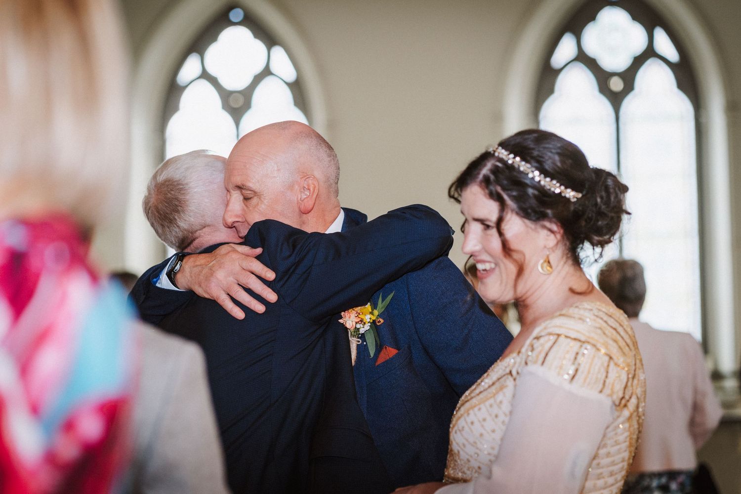 A romantic wedding moment captured in a series of photos showing couples embracing and kissing during the ceremony.