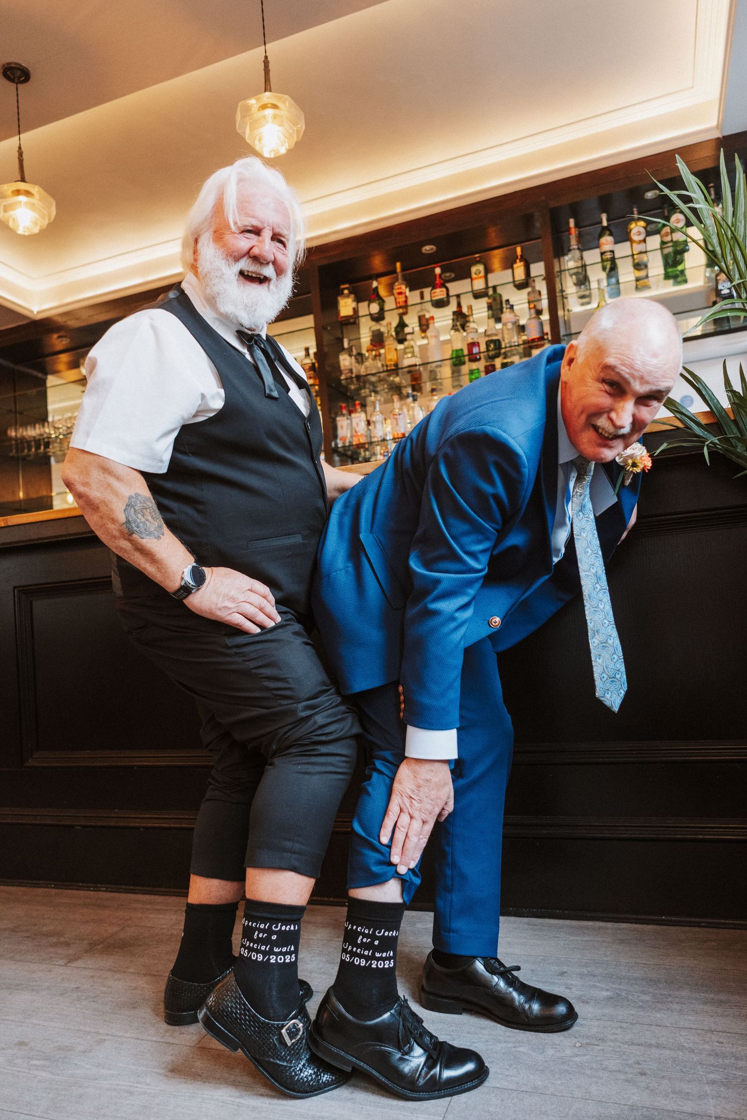A series of images showing someone demonstrating how to tie shoelaces in a bar setting.