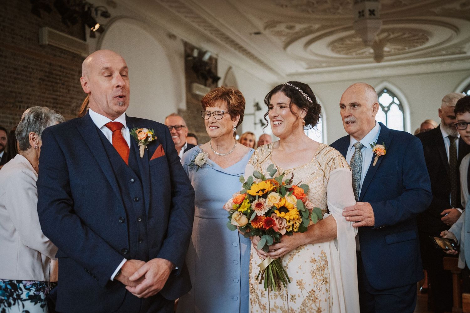 A series of joyful wedding party moments showing celebrations and candid reactions at an elegant indoor venue.