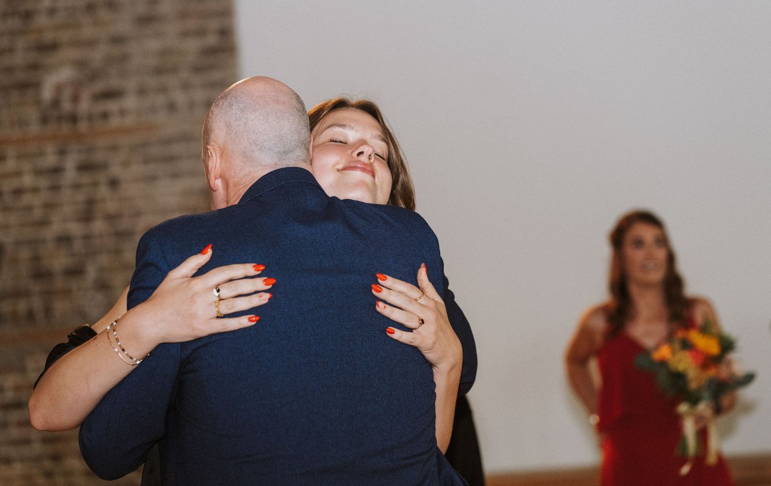 A sequence of images showing tender embraces and hugs between people at what appears to be a social gathering.