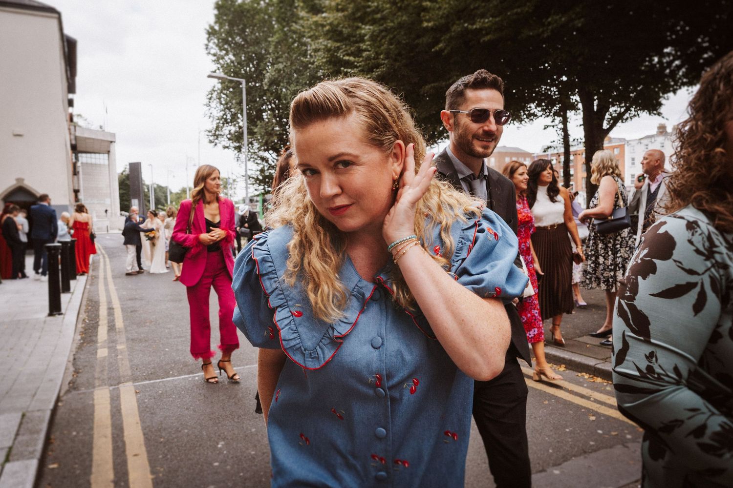 A collage of photos showing people embracing and walking together on city streets in casual denim outfits.