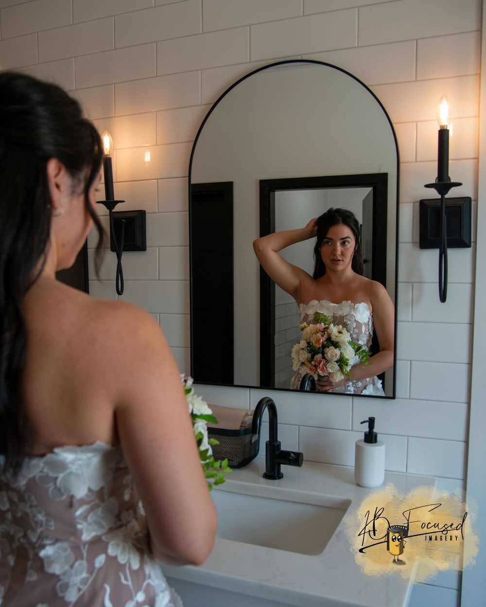 Elegant bathroom interior with mirrors and wedding dress details.