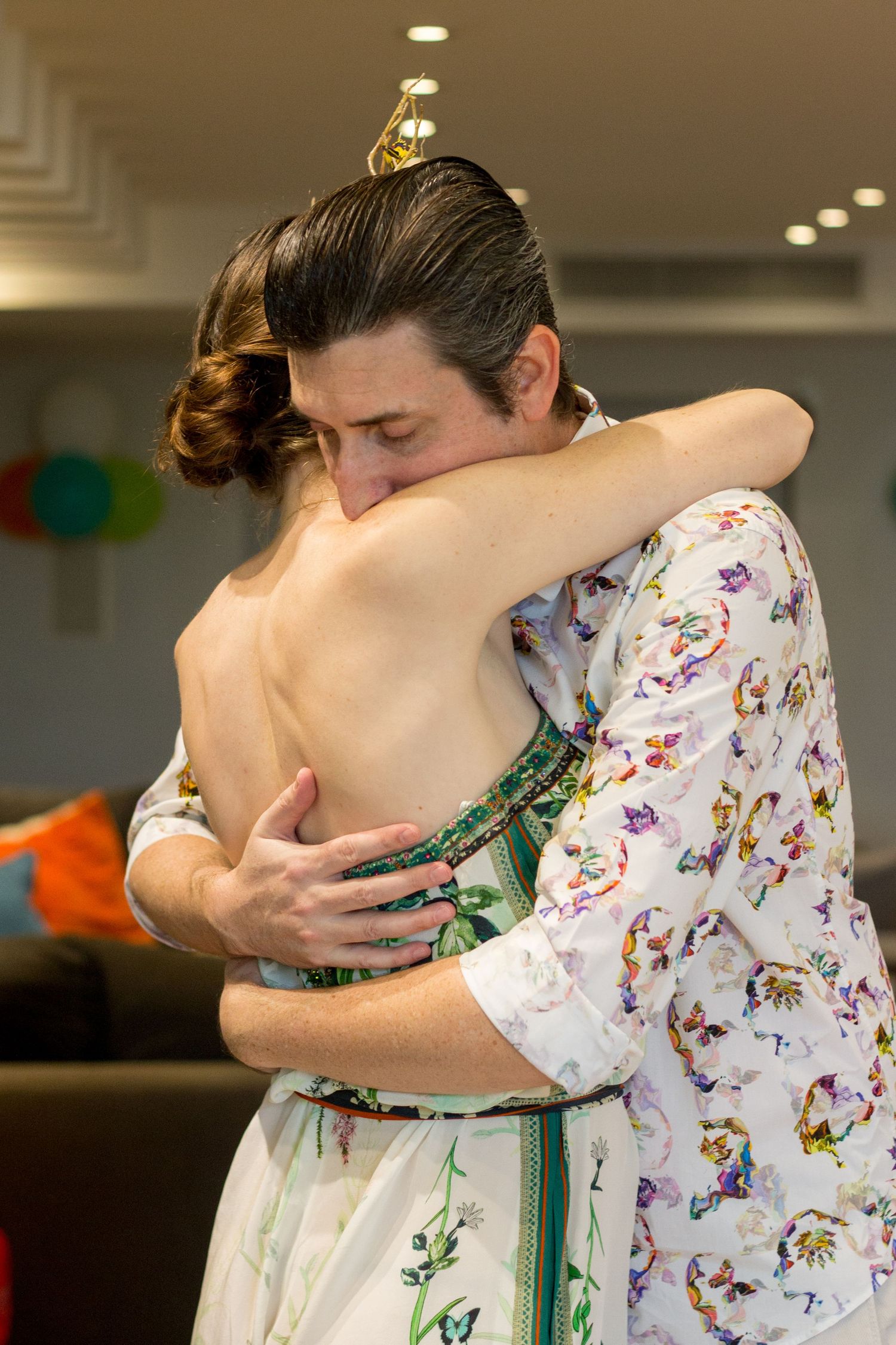Man and woman hugging. First birthday party in Dorado, Puerto Rico.